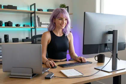 Mira at a streamlined desk with one unified setup, dock, and display path