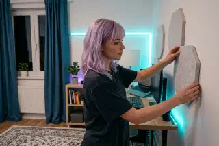 Mira adding simple acoustic panels in a small apartment workspace